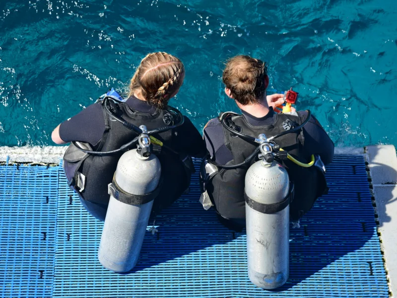 Dive buddies doing safety checks